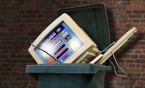 old website and computer in trash can